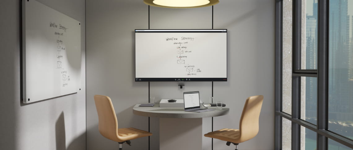 An image of a PanaCast camera being used in a video conferencing room, the screen displays a close up of the whiteboard in the room using the whiteboard sharing feature.